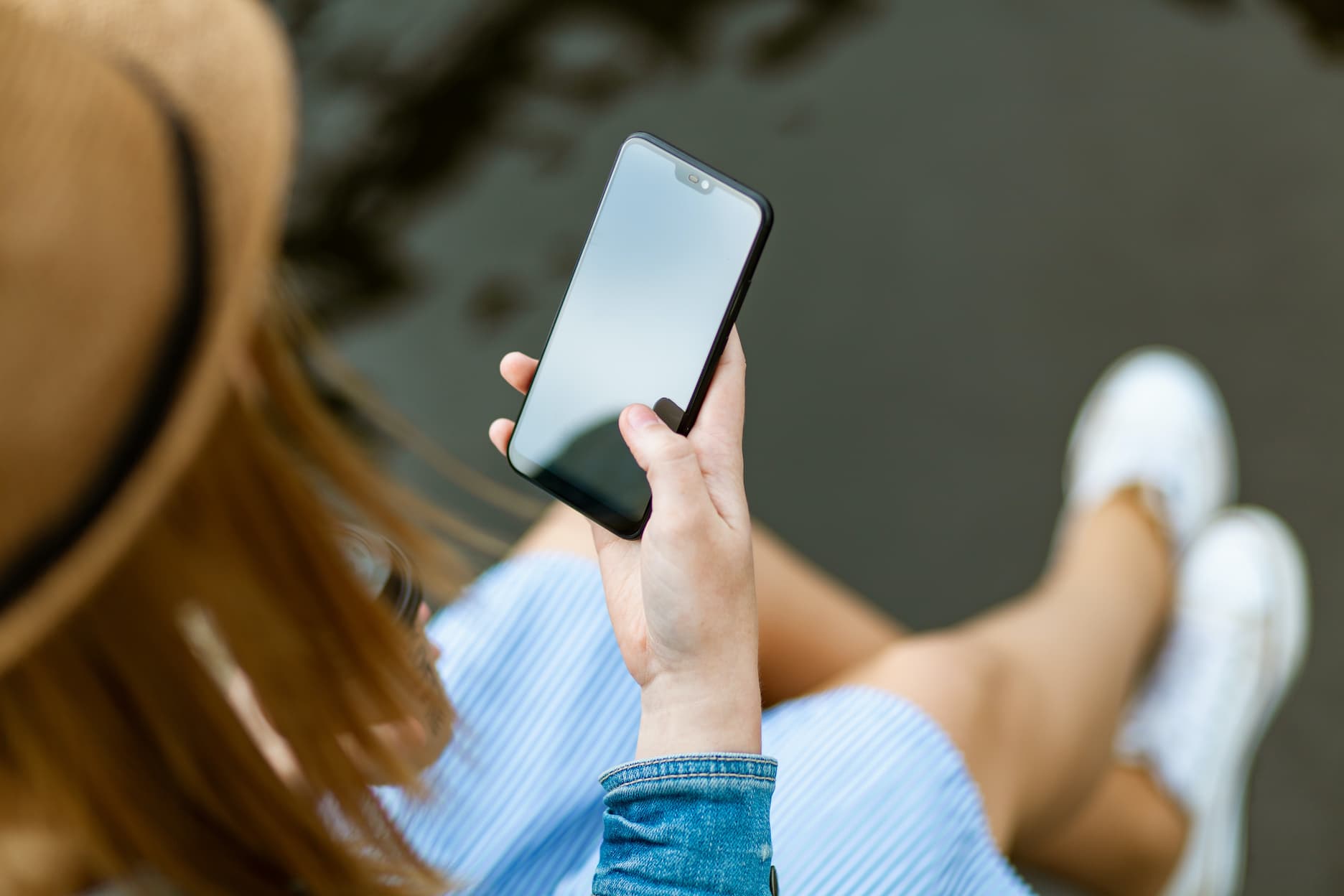 Woman looking down at her phone